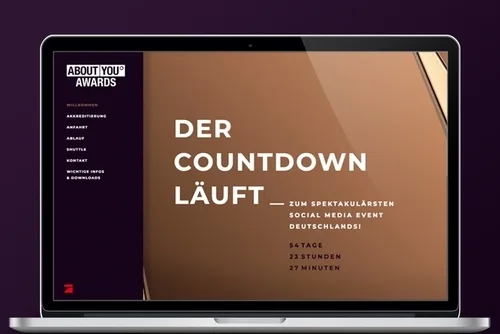 Event landing page of the ABOUT YOU Awards on a laptop: countdown, accreditation, directions, schedule, shuttle