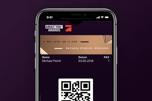ABOUT YOU Awards ticket on a phone with QR code, name, date and plus-ones