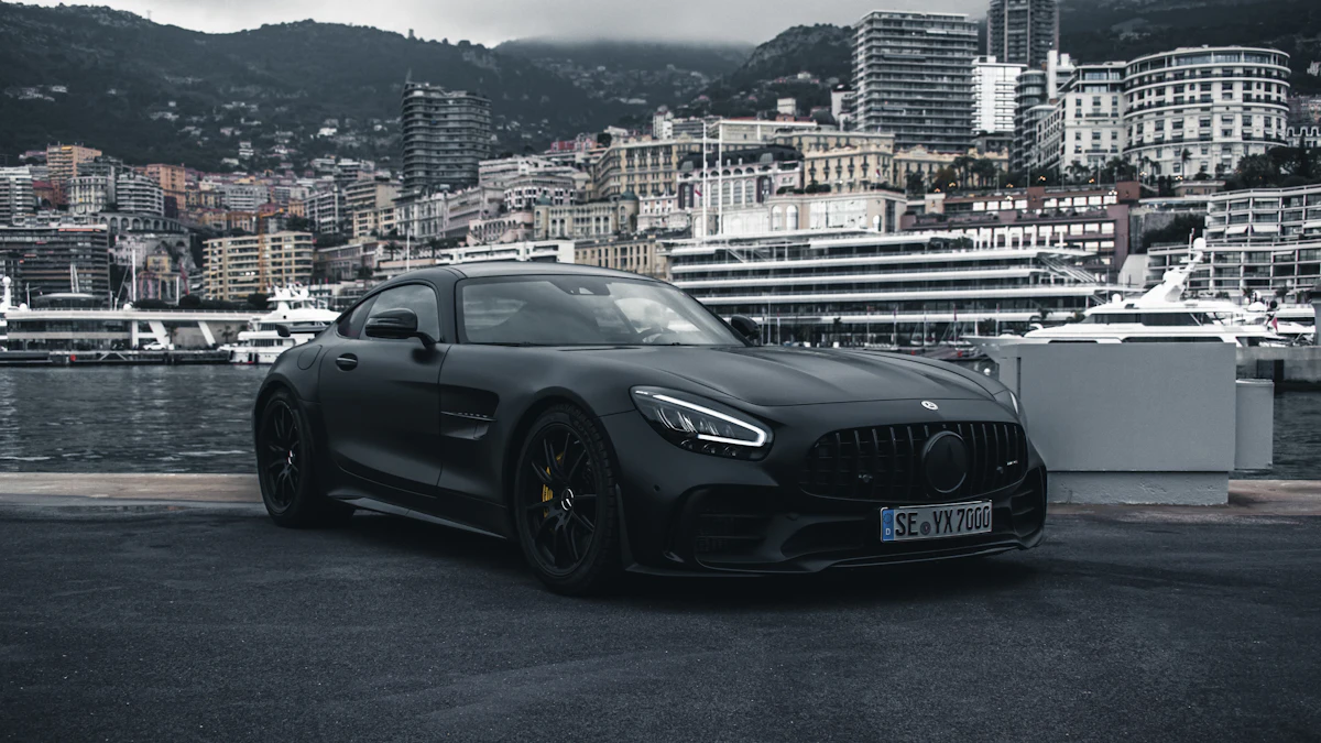 Matte black sports car on a harbor quay