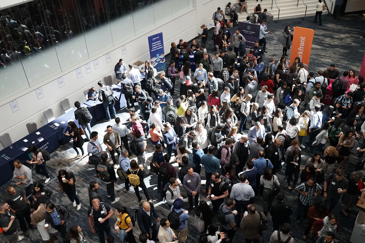 Attendees in the lobby of a conference venue