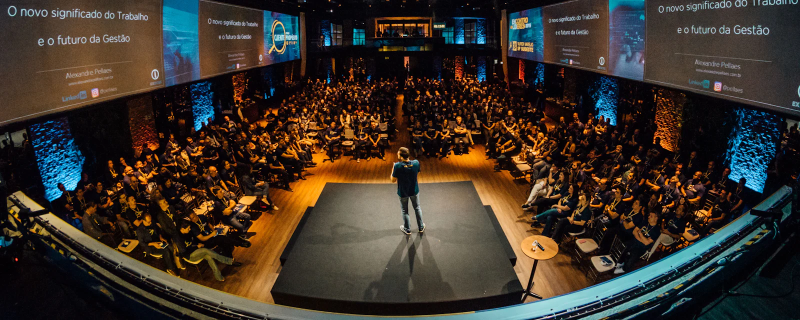 Keynote on a large conference stage in front of a full hall